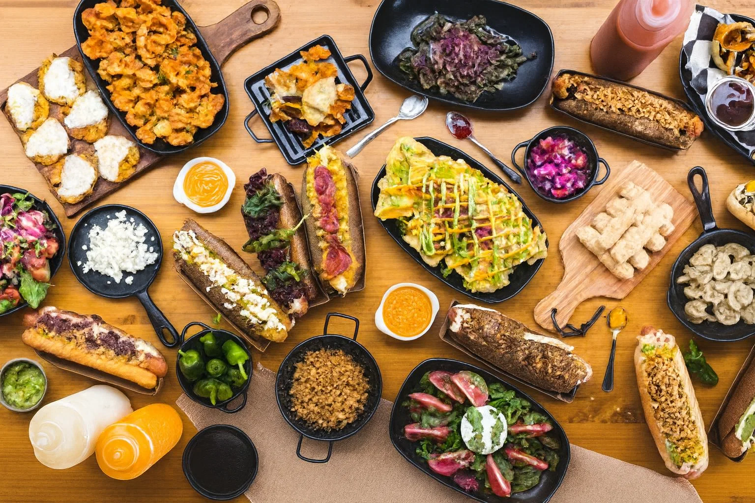 Top-down view of a gourmet food spread with sandwiches and sides, demonstrating image to music technology for culinary moments.
